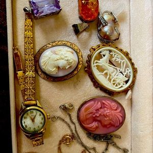 A vintage mix bundle of brooches and pendants and a watch